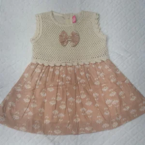 Peach floral baby girl dress with cream knitted top and matching bow,